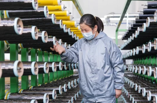 Actex employees are inspecting the quality of carbon fiber Actex employees are inspecting the quality of carbon fiber
